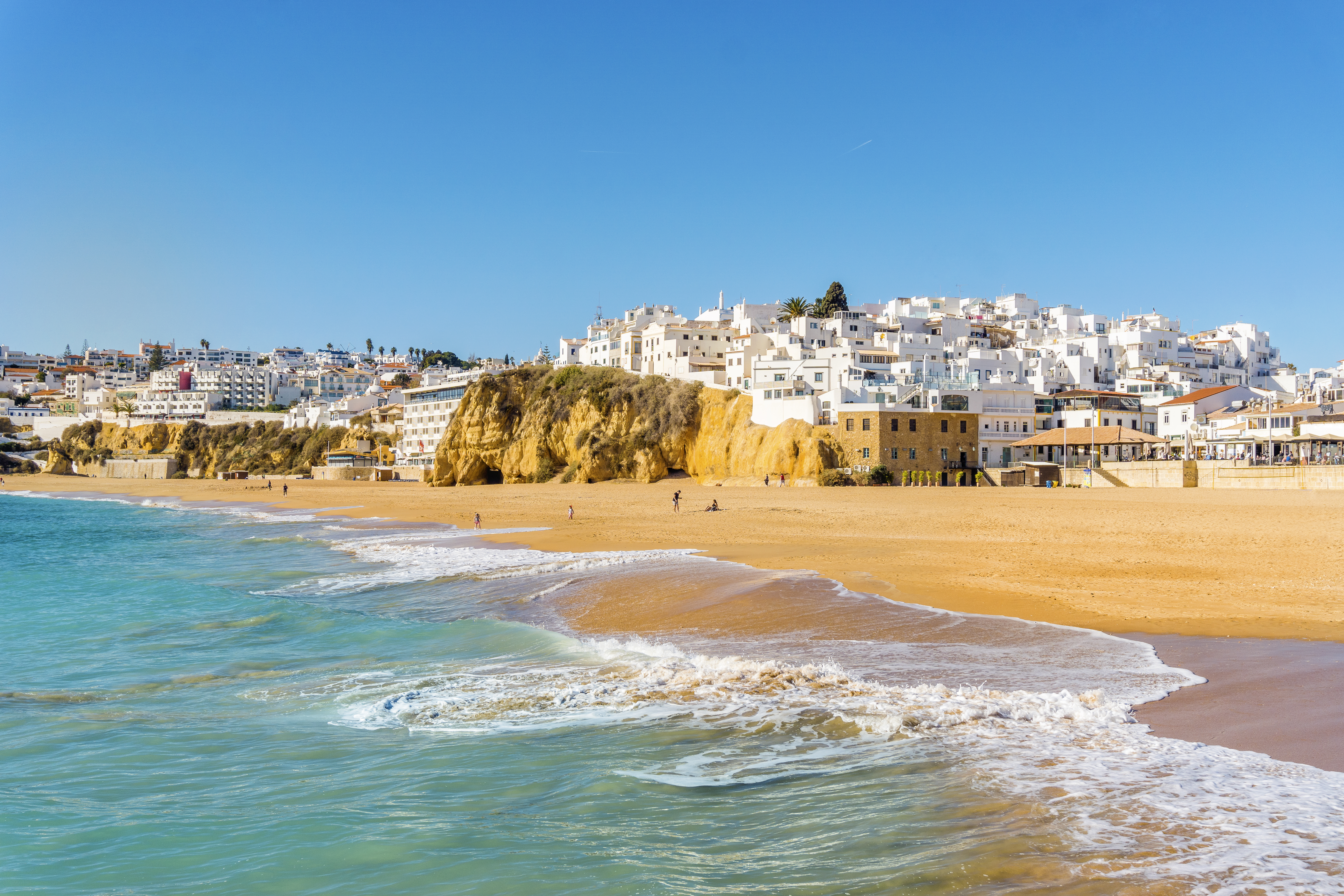 The wide, sandy beach in the white city of Albufeira in the Algarve, Portugal