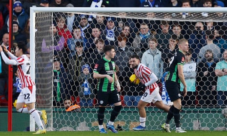 Stoke City's Bae Jun-Ho and Sead Haksabanovic celebrate their first goal, an own goal scored by Brighton's Jan Paul van Hecke.