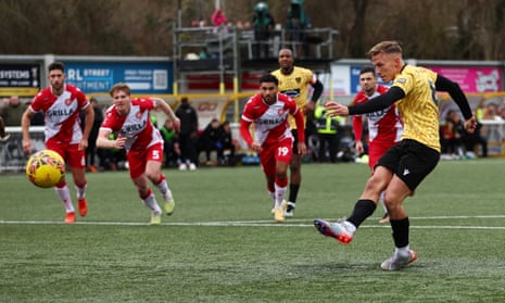 Maidstone United's Sam Corne scores their first goal from the penalty spot against Stevenage.