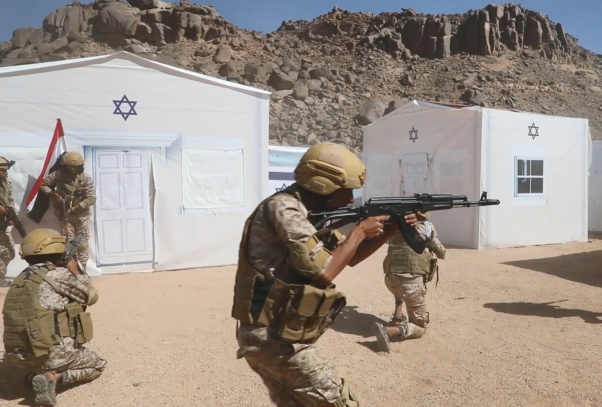 Houthi troopers take part in a military exercise near the Yemen-Saudi Arabia border