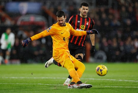 Alisson clears the ball for Liverpool.