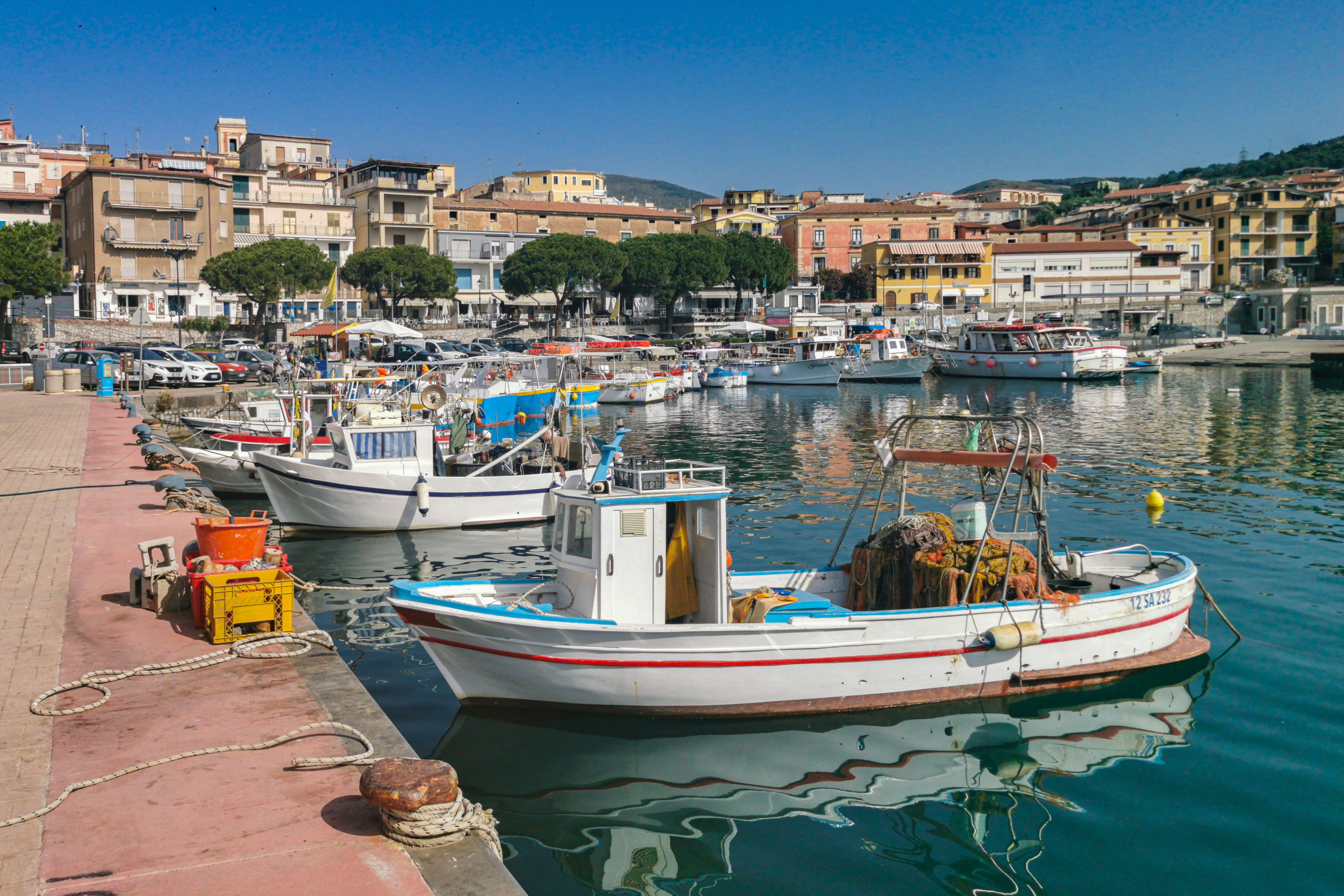 Colourful fishing boats moored at Marina di Camerota port