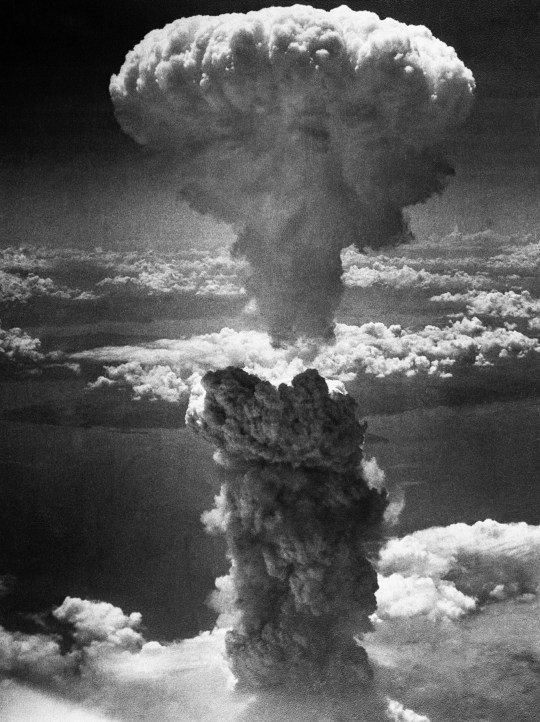 A mushroom cloud towers 20,000 feet above Nagasaki, Japan, following a second nuclear attack by the United States on August 9, 1945. The bombing - which took place three days after the first nuclear attack on Hiroshima - was followed by Japan's surrender on August 14, bringing an end to World War II. | Location: Nagasaki, Kyushu, Japan.