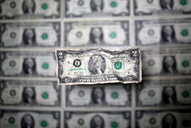 Dollar clings to previous day's gains as focus turns to U.S. data