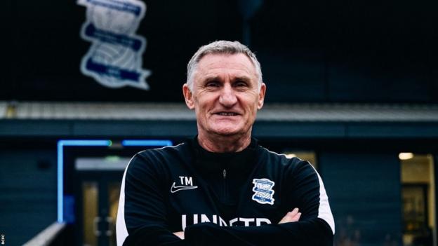 Tony Mowbray smiles as he poses for a photo