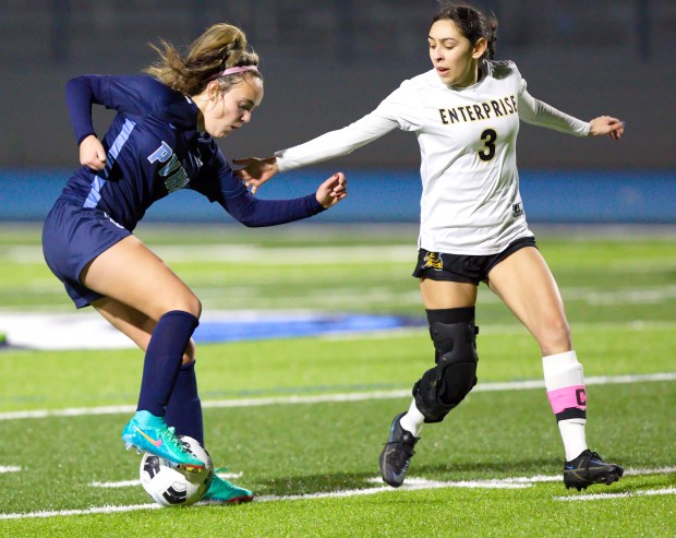 Pleasant Valley's Miley Yuill (left) dribbles against an Enterprise defender in the Vikings' 4-0 win on Wednesday, Jan. 17, 2024 in Chico, California. (Eddie Saltzman/Contributed)