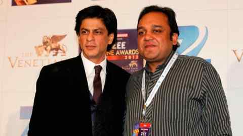 Bollywood actor Shah Rukh Khan, left, with Zee Entertainment chief Punit Goenka in 2012