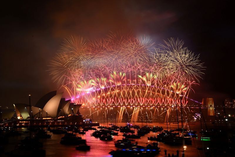 World welcomes 2024 with New Year's fireworks, reflection and a royal farewell