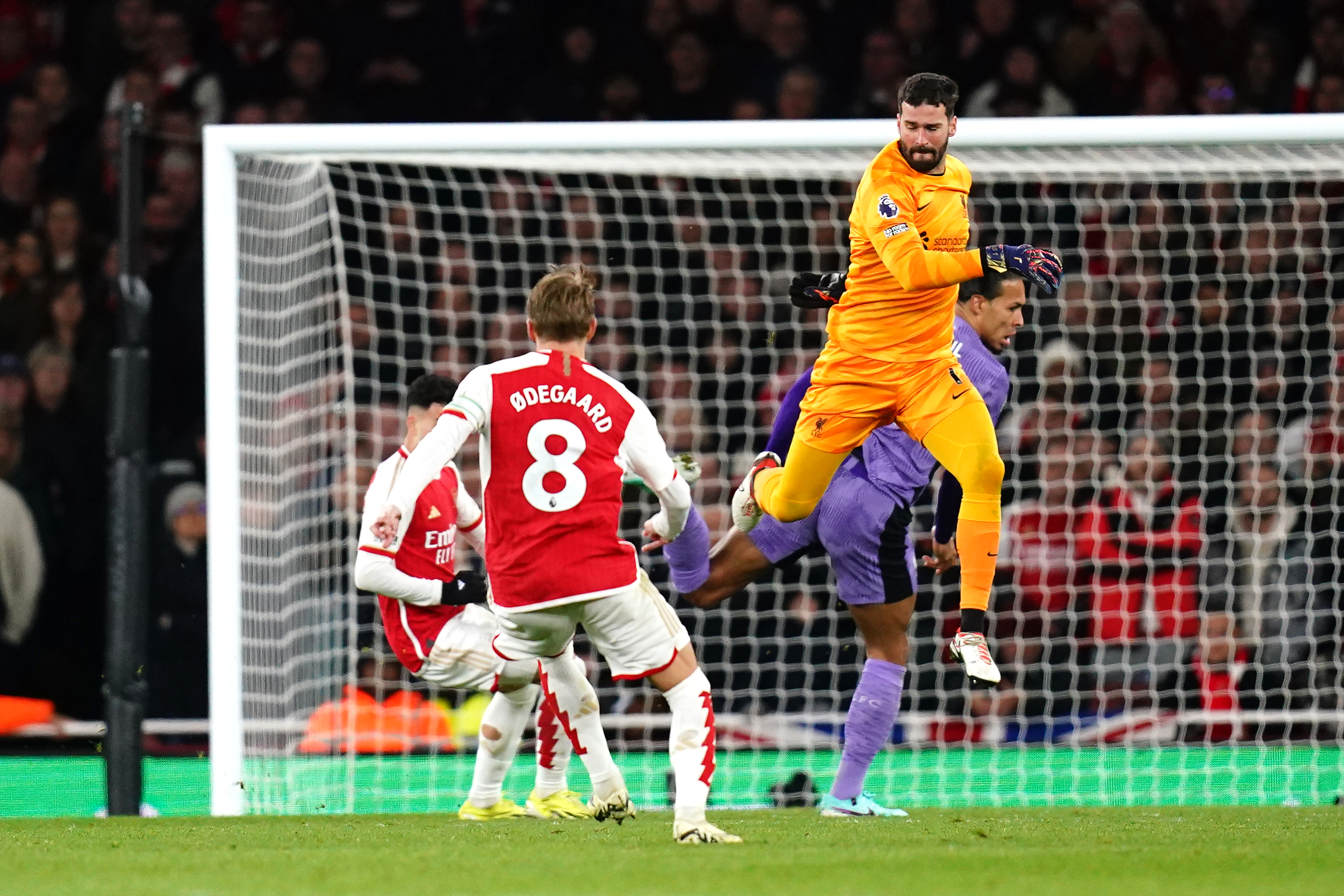 Martinelli, left, had a simple chance to make it 2-1 in the Gunners' 3-1 victory after confusion between Liverpool duo Alisson and Van Dijk