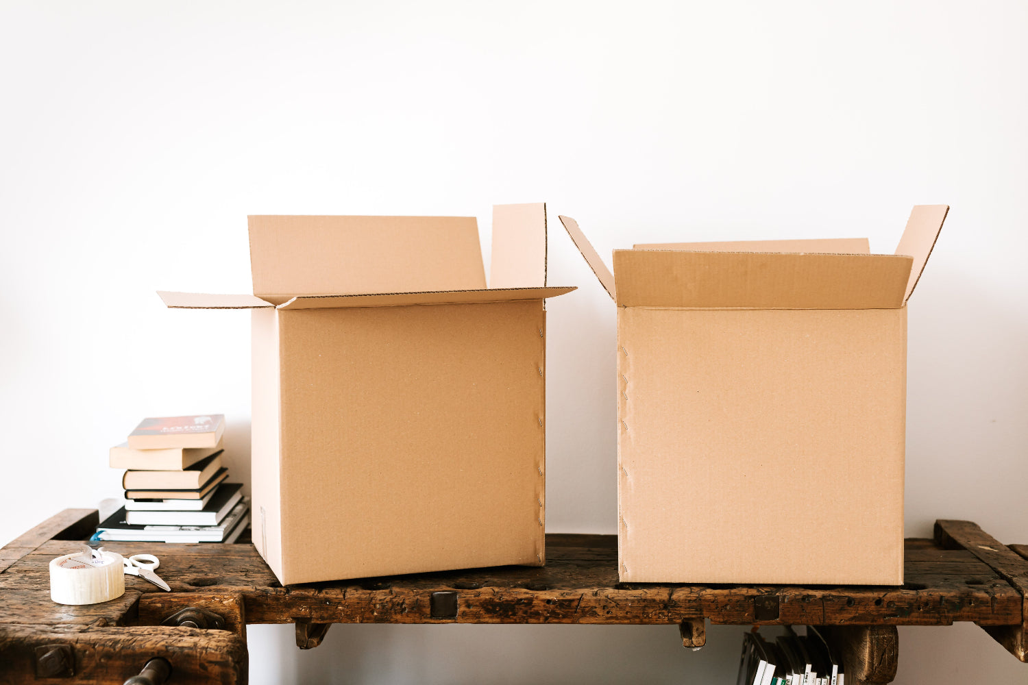 Two empty cardboard boxes on a table