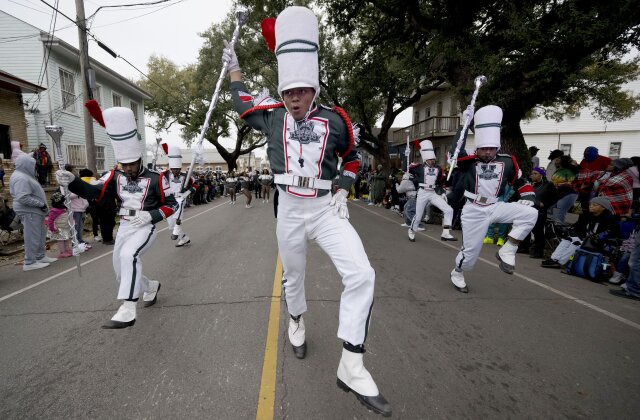 Drum majors from the Mississippi Valley State University marching band parade down Jackson Ave during the traditional Krewe of Zulu Parade on Mardi Gras Day in New Orleans, Tuesday, Feb. 13, 2024. (AP Photo/Matthew Hinton)