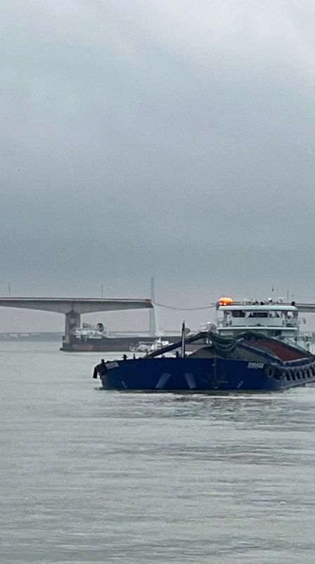 Two killed after barge hits bridge near China's Guangzhou, plunging vehicles in water