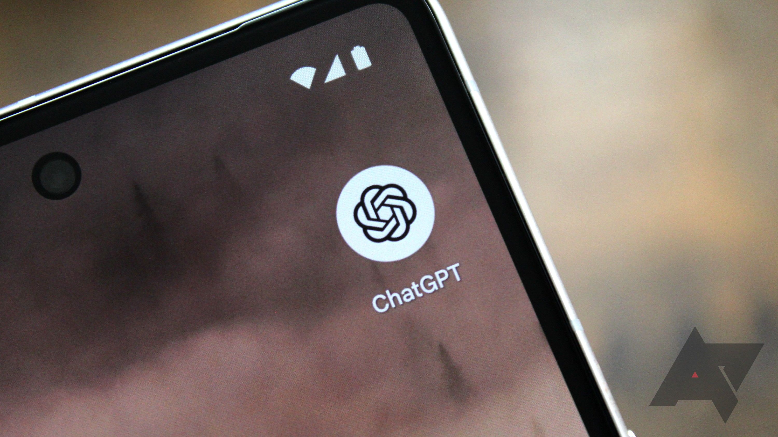 The ChatGPT logo in the corner of a phone screen.