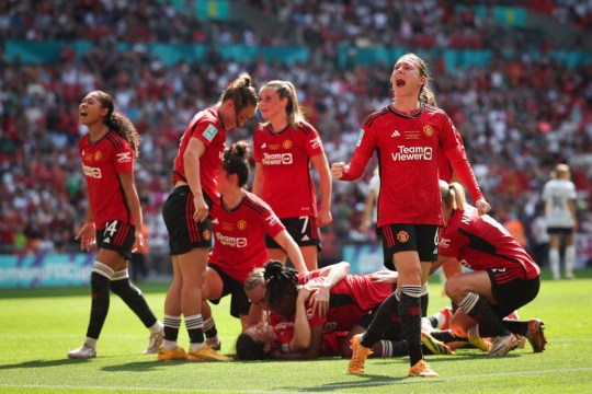 Rachel Williams celebrates with teammates after her goal for Man Utd against Tottenham