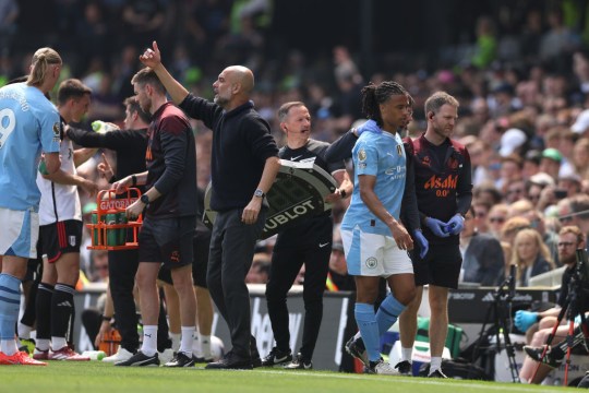 Nathan Ake of Manchester City is substituted off after sustaining an injury during the Premier League match between Fulham FC and Manchester City at Craven Cottage