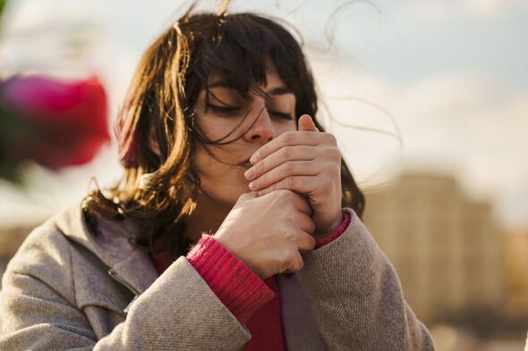 Young woman lighting a cigarette