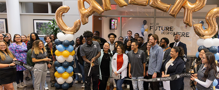 The grand opening of the new Career Success Studio included a ribbon cutting, cake and collecting words of wisdom from current students on Nov. 8.