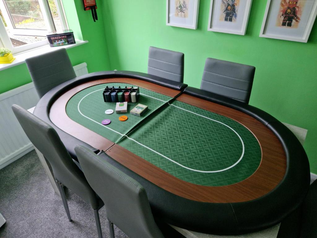 A poker table with chips offers a place for parents to play in the evenings