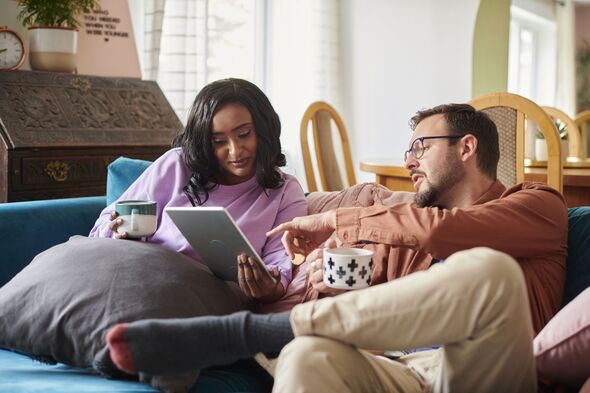 Couple working out finances at home