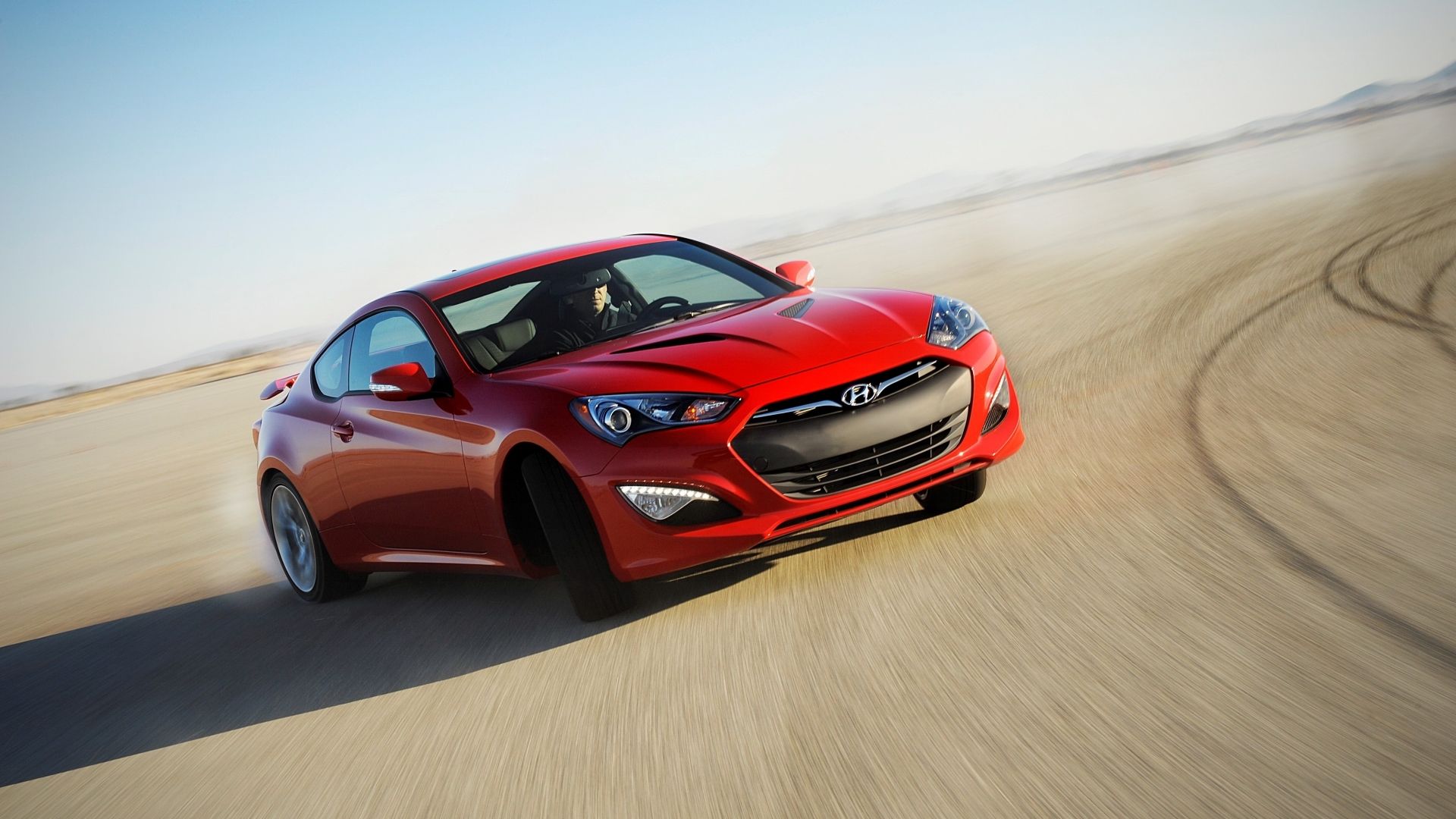 Front 3/4 shot of a 2016 Hyundai Genesis Coupe drifting 