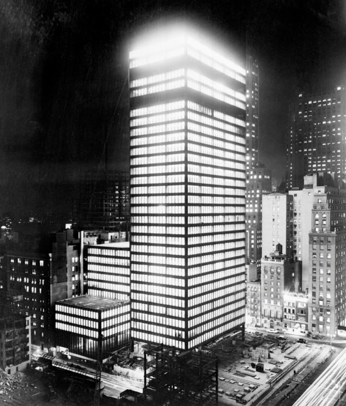 The Seagram Building at 375 Park Avenue, the world’s first bronze skyscraper, light’s up the night sky in Manhattan, New York City