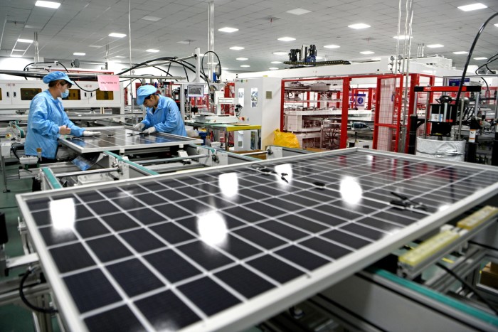 Employees on a solar panel production line in China. 