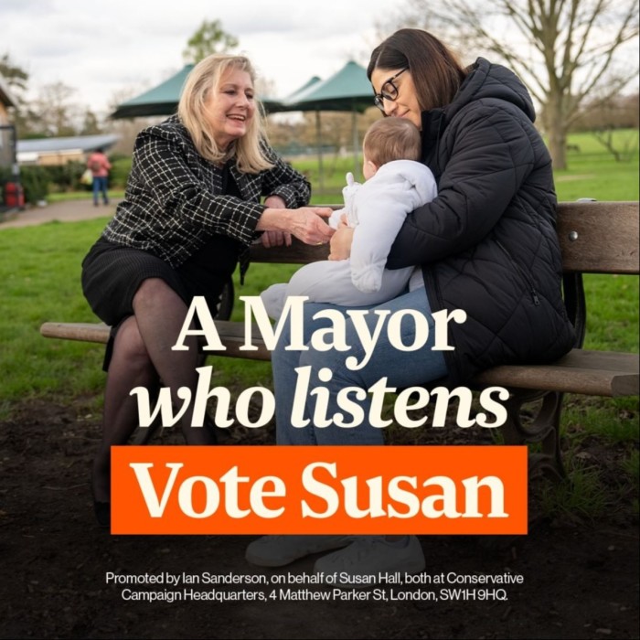 Conservative mayoral candidate for London Susan Hall sitting with a member of the public with a baby on a park bench as part of a promotion photo  