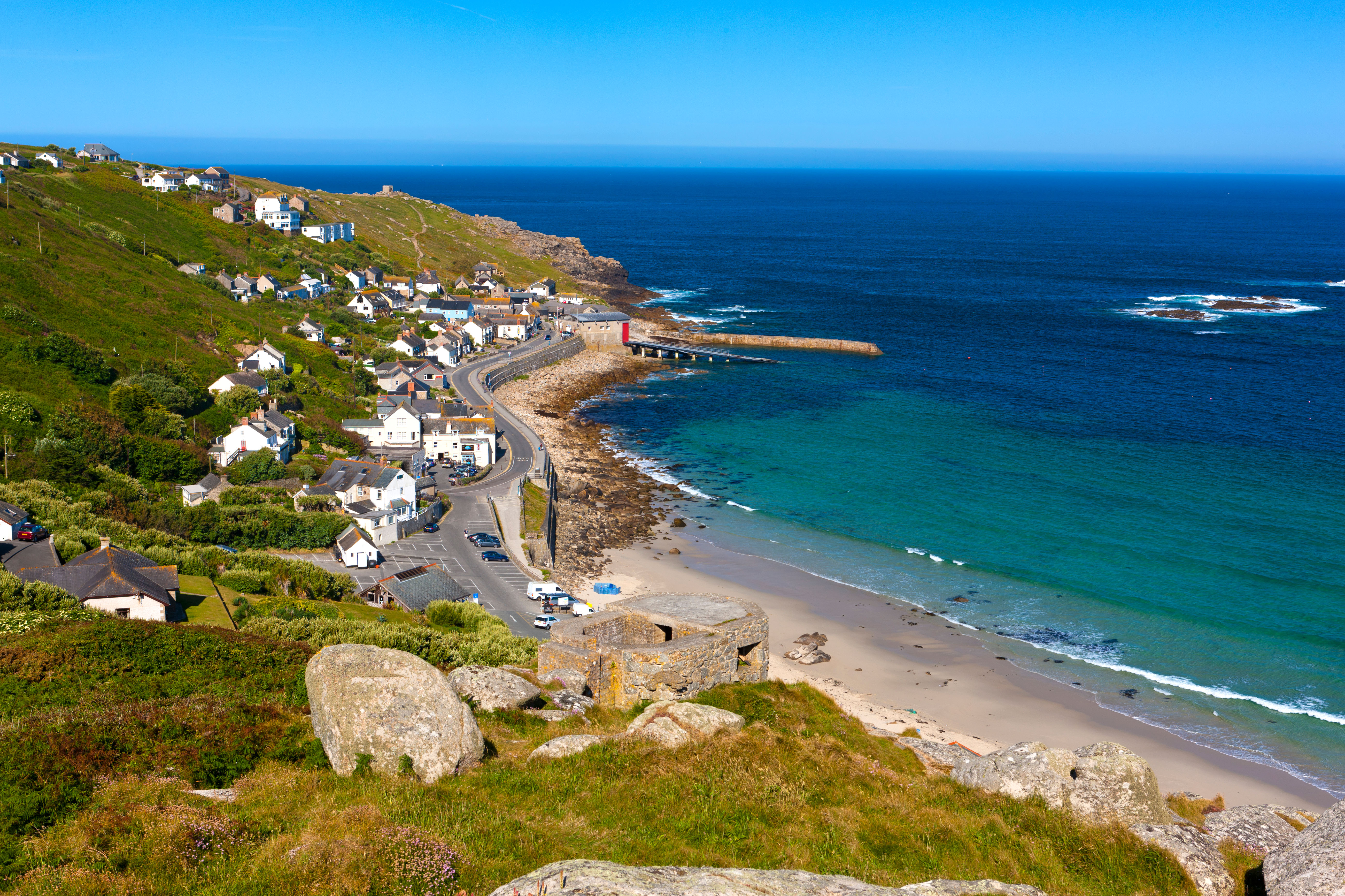 Sennen Cove is home to thatched cottages, many of which overlook the harbour