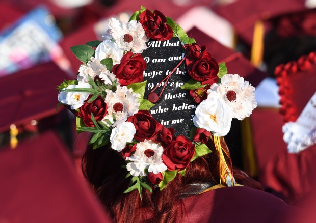 A graduate’s decorated cap shares her gratitude during the Indian...