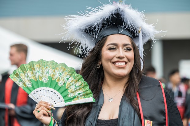 Chaffey College graduates “accessorized” their caps and gowns for the...