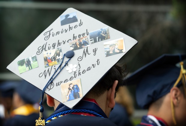 A Carter High School graduate’s cap celebrates his high school...