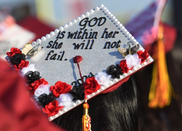 Darlene Jaramillo’s decorated cap shares her faith during the San...