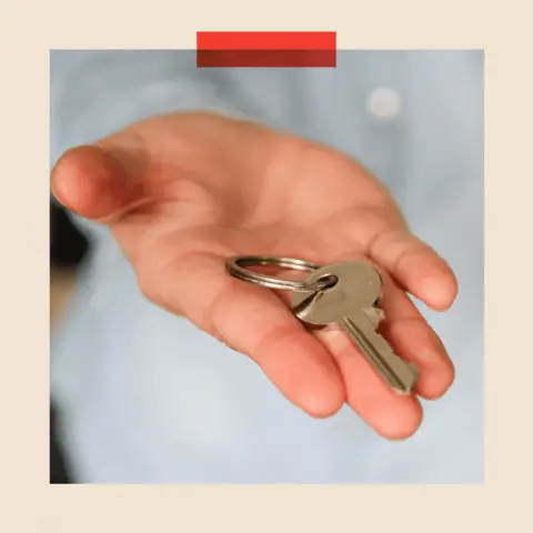 Getty Images A hand holding a key