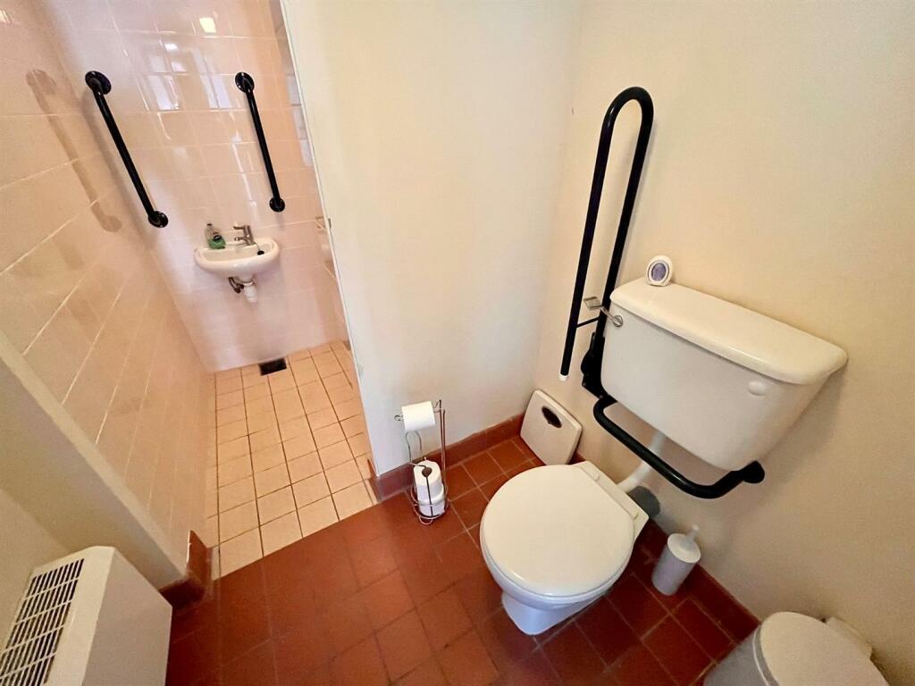 There are two bathrooms, with this one's sink having it's own room