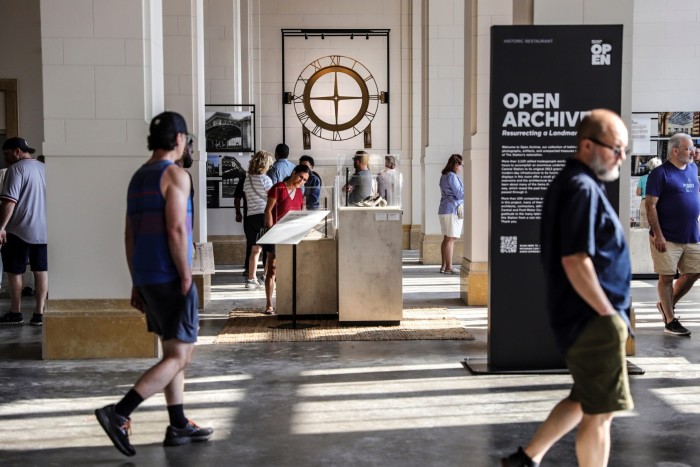 Visitors browse on the first floor of Michigan Central Station this month