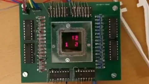  Linköping University A green circuit board with a small basic display in the middle showing three red numbers