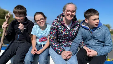 BBC Oran with his mum, Justine, and siblings