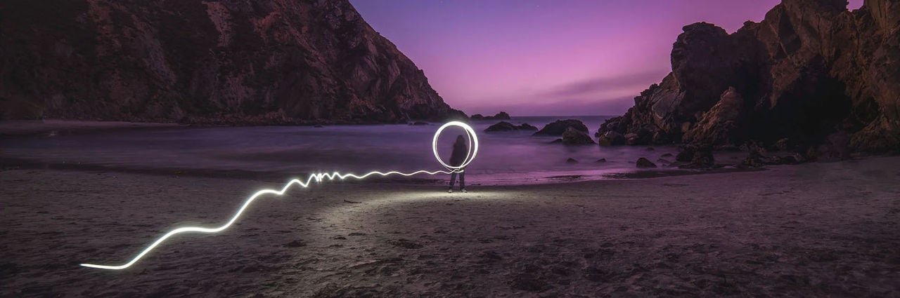 Genai sentiment light painting person night beach