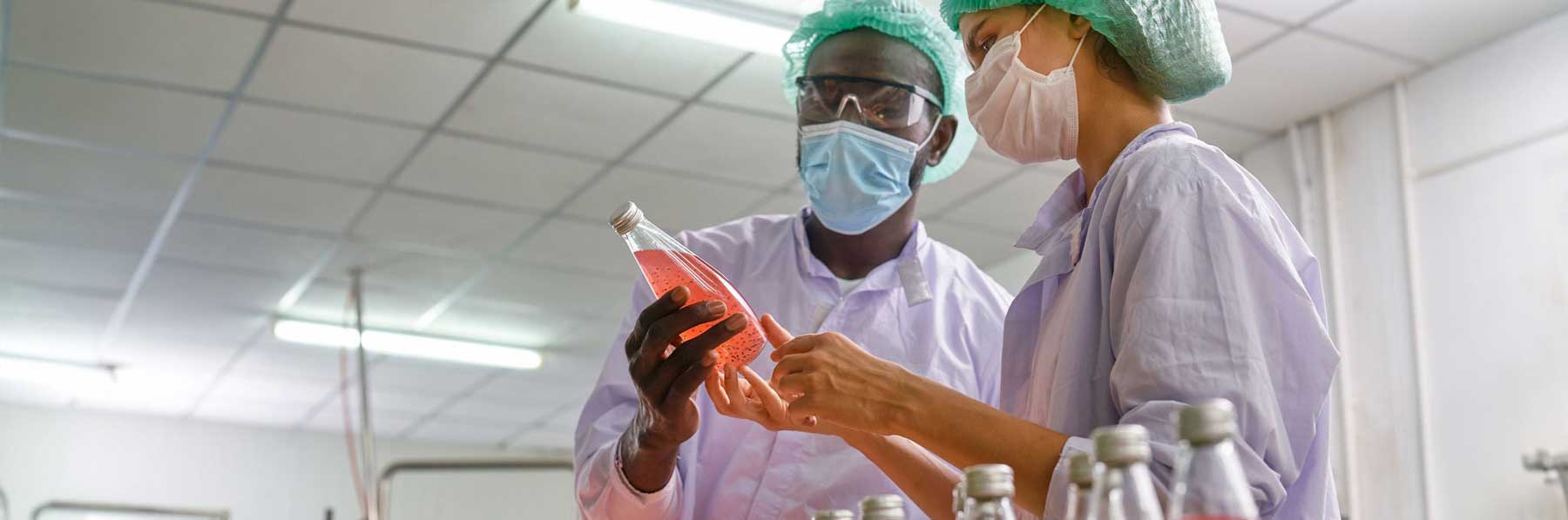 Beverage specialists checking the quality of a juice product