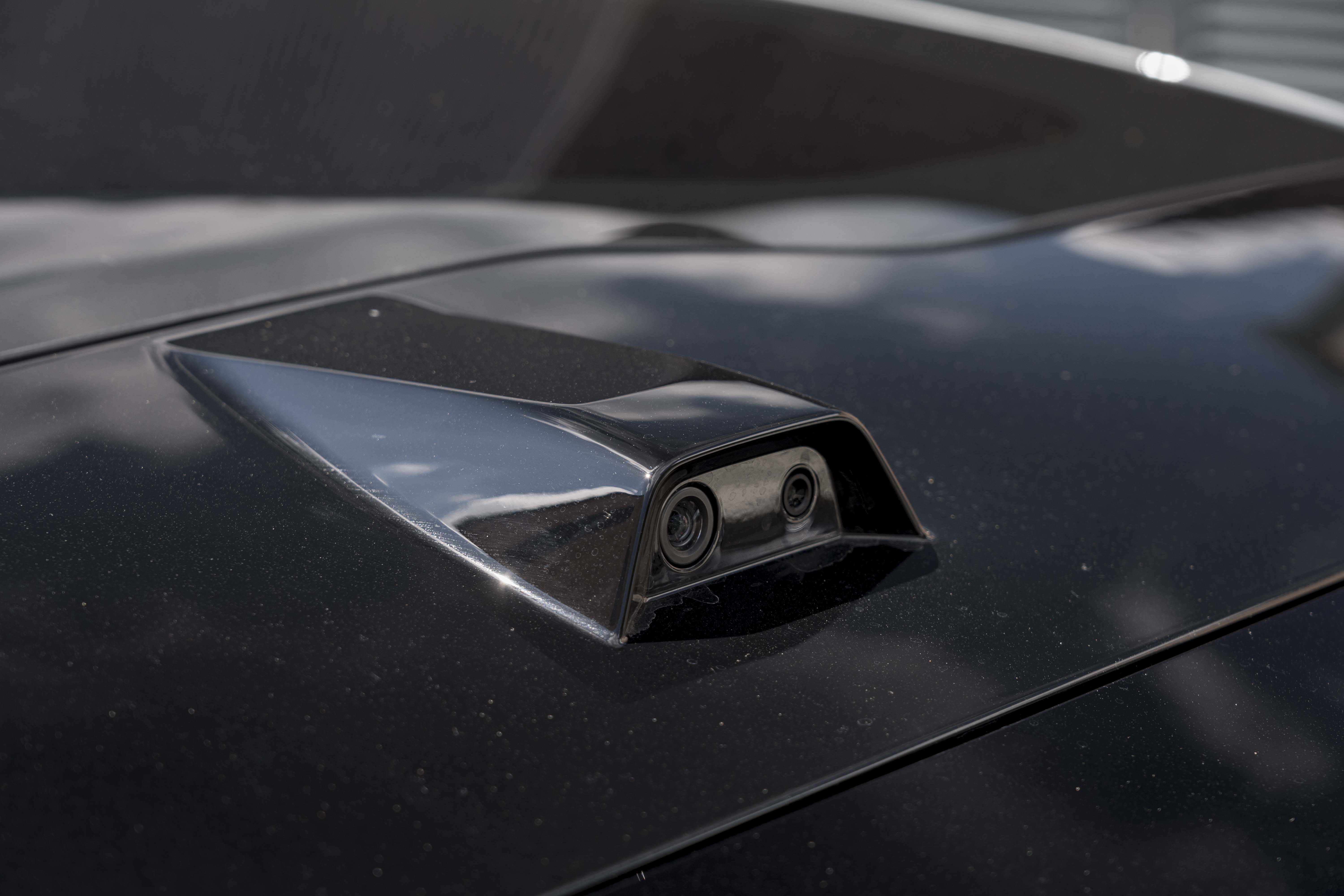 There is a roof-mounted camera that replaces the rear window