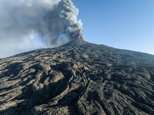 Mount Etna spewing plumes of ash into the air