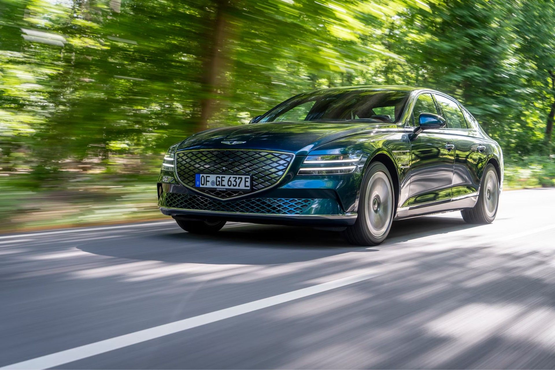 2023 Genesis Electrified G80 driving on a highway