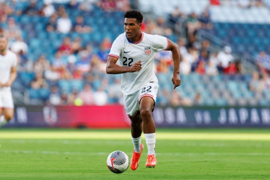 Caleb Wiley #22 of the United States U23 dribbles the ball during an under 23 game between Japan and USMNT at Children's Mercy Park