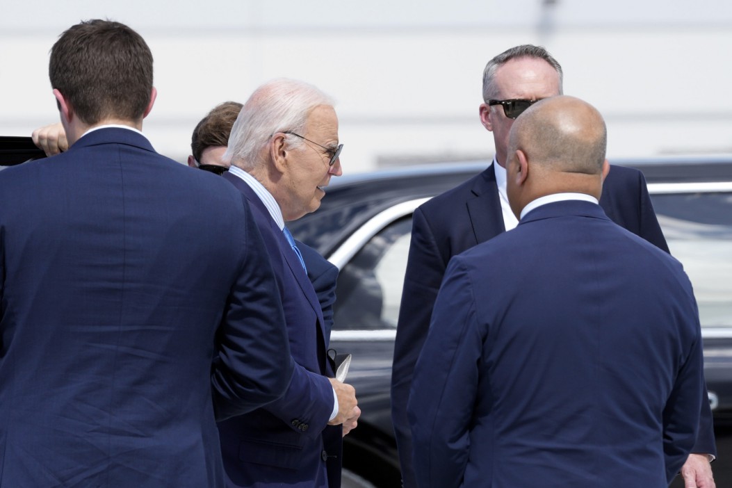 Biden was pictured boarding Air Force One after he was diagnosed with Covid-19