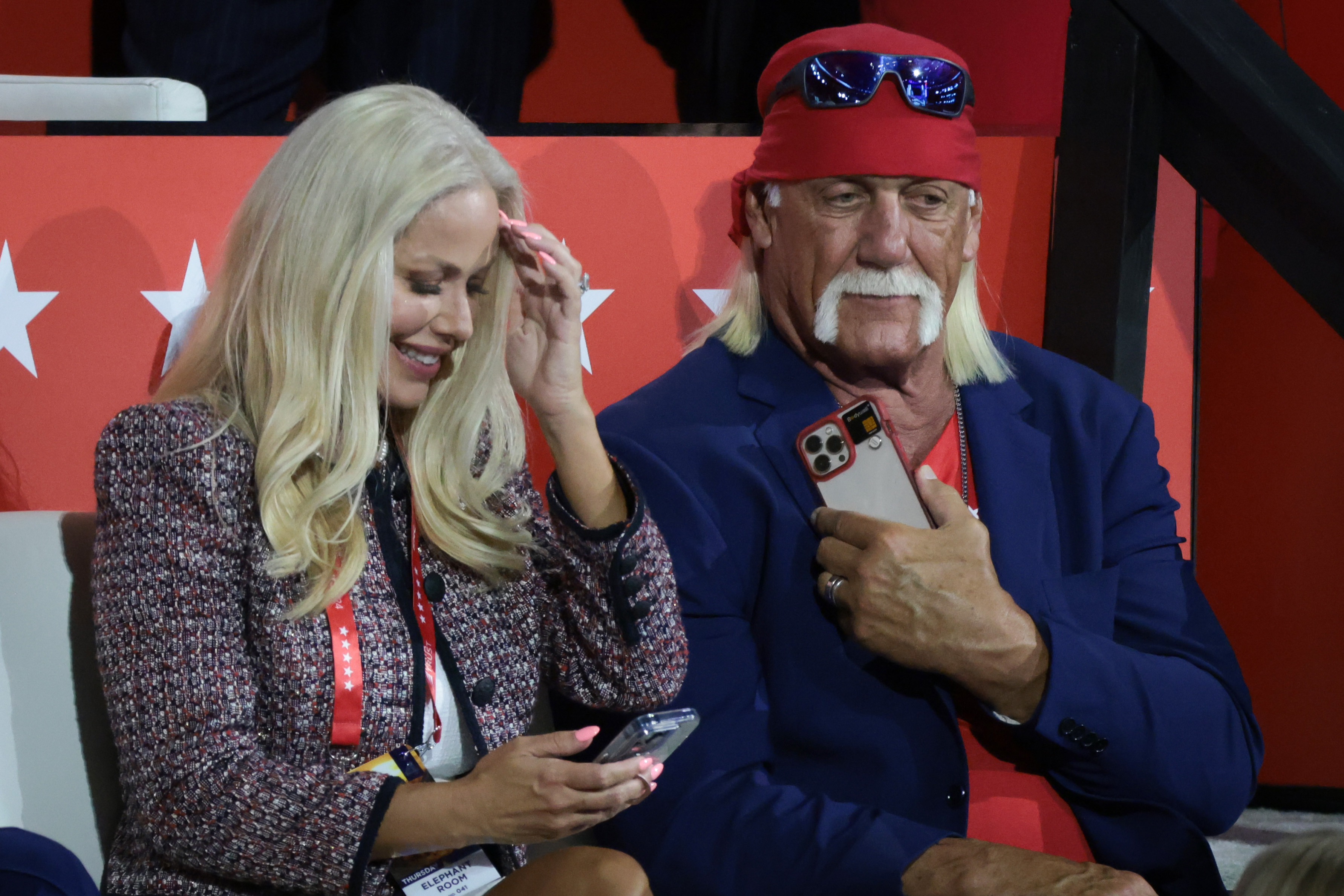 Professional entertainer and wrestler Hulk Hogan sits with his wife Sky Daily