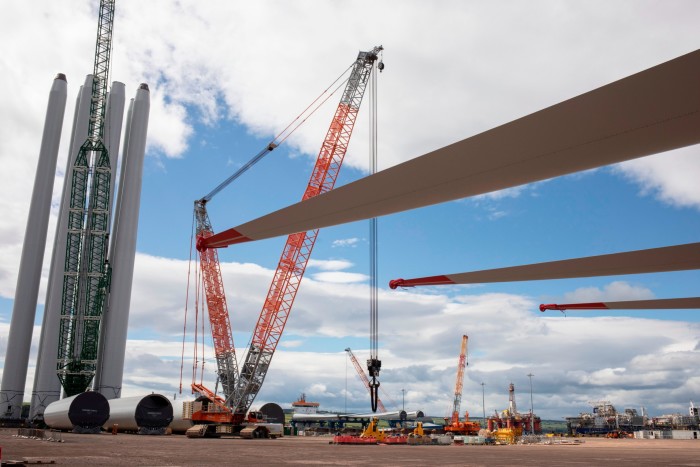 Wind turbine components lay in the Port of Nigg