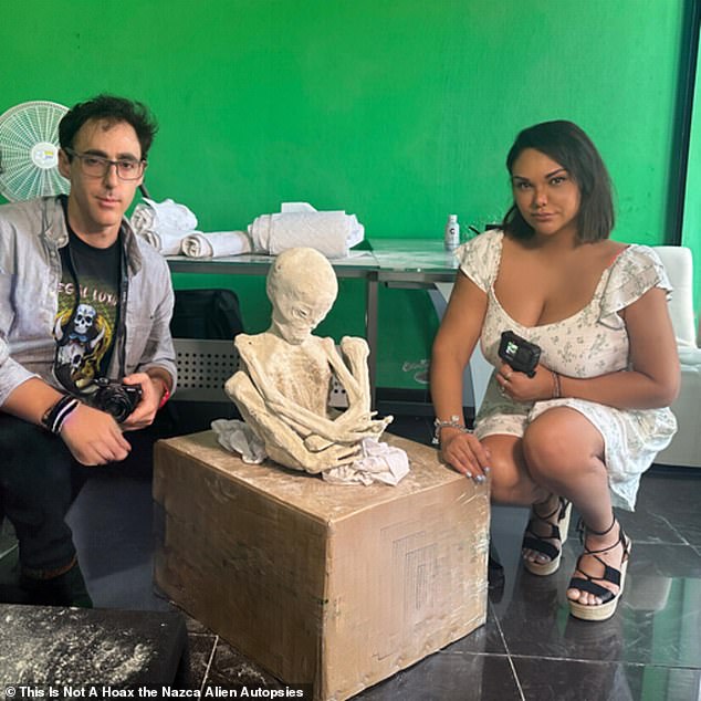 Above, two of Maussan's collaborators, documentarians Serena DC (right) and Michael Mazzola (left), pose with a new 'alien' mummy from this March - which they said has 30 percent 'unknown' DNA