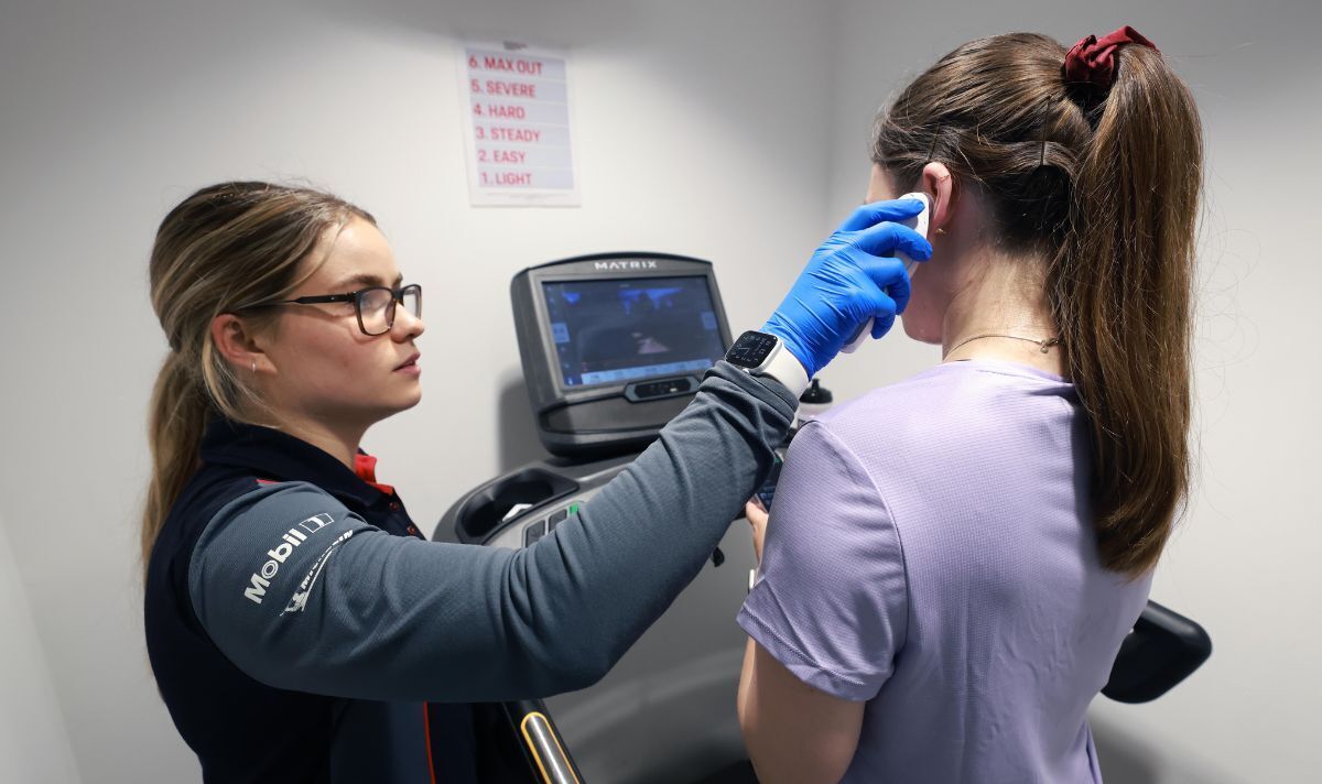 Hanna having her temperature checked.