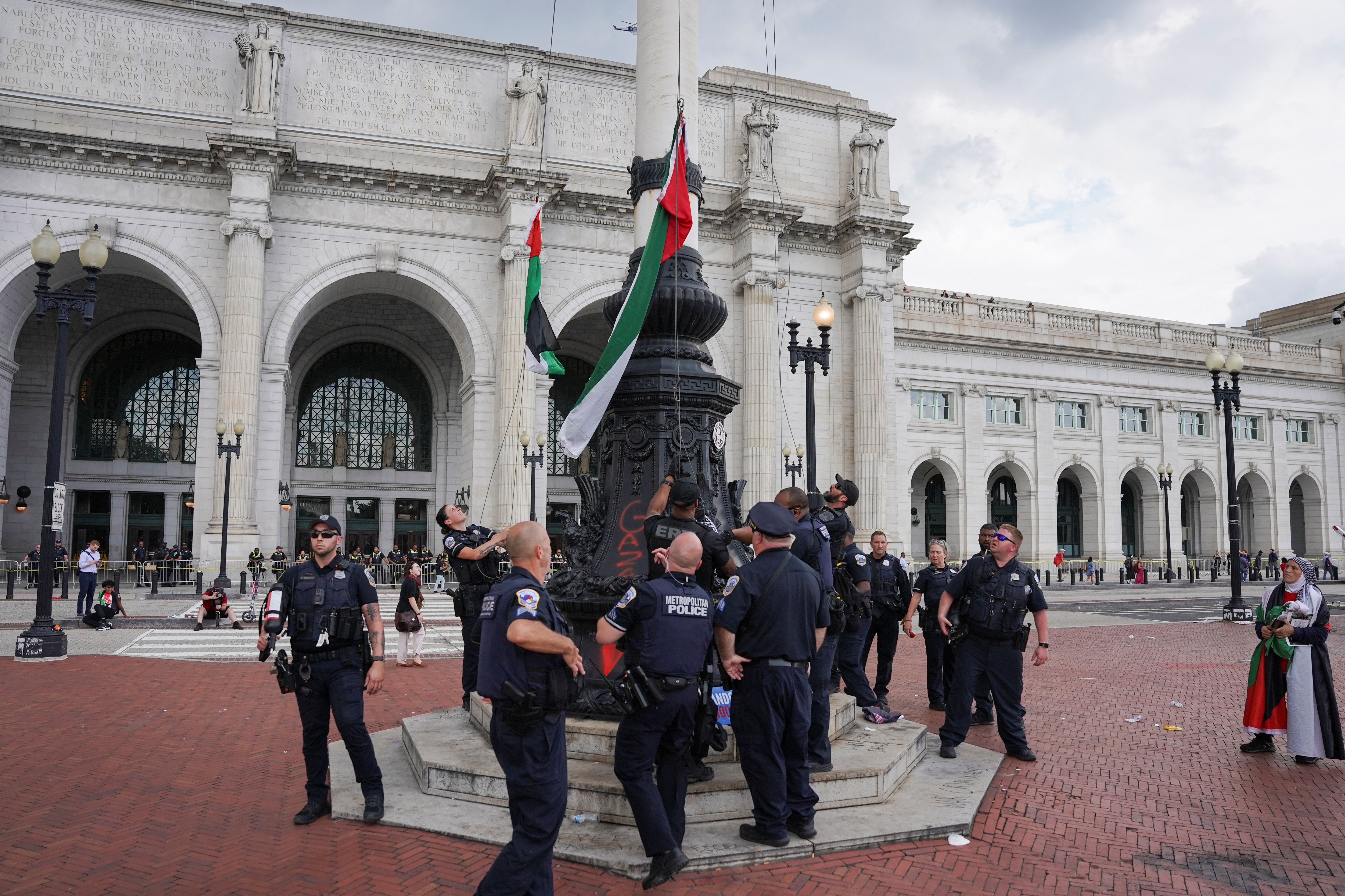 Demonstrators replaced a US flag on a pole with a Palestinian one