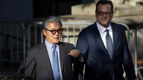 Bill Hwang, left, arriving at the Manhattan federal courthouse on Monday morning